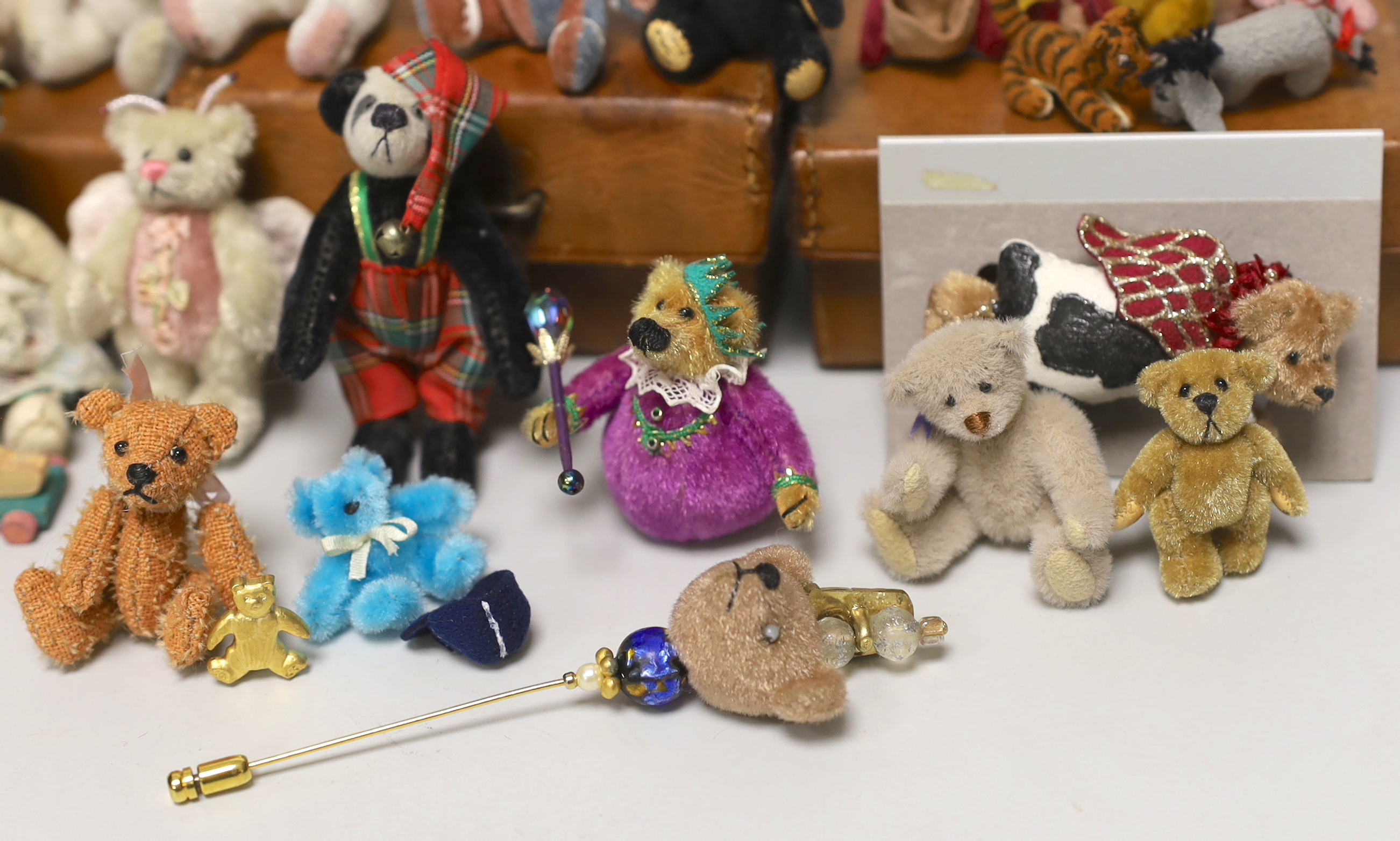 Twenty two miniature Artist bears, assorted teddy bear badges and three teddy bear brooches